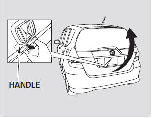 To open the tailgate, pull the handle,  then lift up.