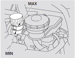 The fluid level should be between theMINandMAXmarks on the side of the reservoir.