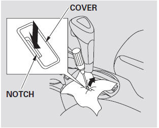 4. Insert the key in the shift lock release slot.