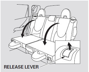 2. Make sure the rear outer head restraint is locked in place. If you fold down
