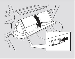 Open the glove box by pushing the button. Close it with a firm push.