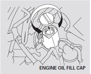 Unscrew and remove the engine oil fill cap on the valve cover. Pour in the oil