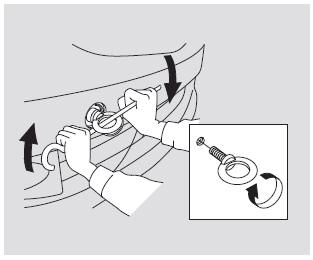 3. Screw the towing hook into the bolt hole behind the bumper, then tighten the
