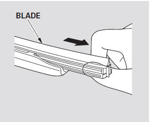 3. Remove the blade from its holder by grasping the tabbed end of the blade.