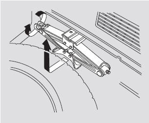 5. Take the jack out of the cargo area.