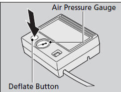 13. Unscrew the sealant/air hose from the tire