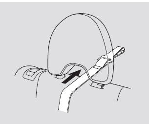 5. Route the tether strap over the seat-back and through the head restraint legs.
